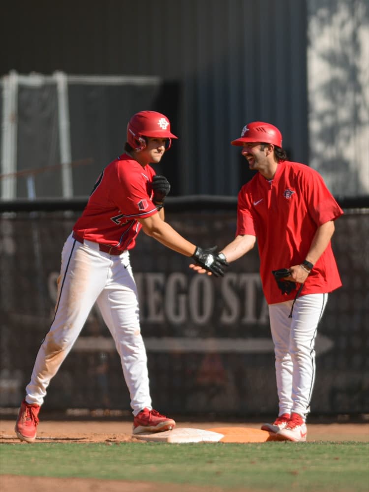 Blake McDonald coaching first base at San Diego State